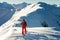 Male ski tourer enjoying the view on a summit in the alps