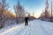 Male skier rides in the winter park at sunset