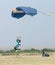 Male skydiver coming in for fast landing on grass Landing Seri