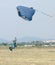 Male skydiver coming in for fast landing on grass Landing Seri