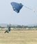 Male skydiver coming in for fast landing on grass Landing Seri