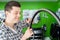 Male Small Business Owner Repairing Wheel In Bicycle Repair Shop