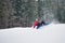 Male snowboarder falls on the slopes during the jumping