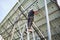 Male solar technician mounting photovoltaic solar panels.