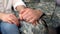 Male soldier holding girlfriends hand, farewell before military service, love
