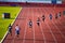 Male Sprinters in Full Stride during a 400m Race on the Athletics Track. Track and field illustration photo for Worlds in Budapest