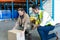 Male staff giving training to female staff in warehouse