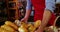 Male staff keeping a basket of bread on counter