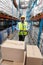 Male staff using pallet jack in warehouse