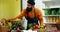 Male staff working at vegetable counter