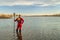 Male stand up paddler dressed in a drysuit and life jacket