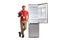 Male store assistant leaning on a fridge and holding a clipboard