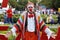 Male street artist `Knitted Clown` at the festival `Bright people` in the park Gorkogo at the City Day in Moscow