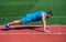 male strength and power. sportsman in plank. athlete do pushups. train his core muscles. man doing push ups exercise on