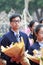 Male student holding flowers ready to dedicate to teacher, adobe rgb