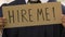 Male student holding hire me sign, future career expectations, opportunities