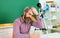 Male student preparing for test or exam. Back to school. September 1. Pensive teacher prepares lessons in classroom