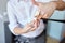 Male stylist hands cutting hair tips at salon