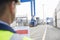 Male supervisor with clipboard in shipping yard