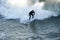 Male surfer enjoying the big wave in Oceanside