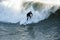 Male surfer enjoying the big wave in Oceanside