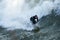 Male surfer enjoying the big wave in Oceanside