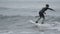 Male surfer rides storm wave in Pacific Ocean on Kamchatka. Slow motion