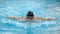 Male swimmer doing butterfly stroke during training in swimming pool, Slow motion.