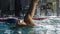 Male swimmer swims in pool. Slow-motion