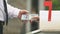 Male taking dollar banknotes from post box, money transfer, bank service payment