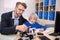 Male teacher touching buildable car, boy listening