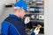 Male Technician Examining Fusebox