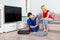 Male Technician Installing TV Set Top Box At Home