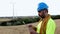 Male technician worker working with digital tablet on wind farm
