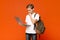 Male teen student concentrating, working on his laptop