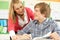 Male Teenage Student Studying In Classroom