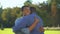 Male teenager hugging elder brother outdoors, family meeting happiness, love