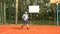 Male tennis player hitting backhand in tennis game