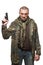 Male terrorist in a military jacket with a gun in