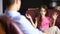 Male therapist conducts a psychological consultation with a teenager. Girl teenager at a reception with a psychologist