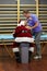 Male therapist massaging overworked Santa Claus