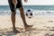 male tossing ball up playing game beach. High quality photo