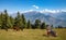 Male tourist biker enjoy view of the Himalaya mountain range with view of wild horses at Uttarakhand India