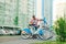 Male tourist chooses a bicycle in the parking lot of Schering. A man rents a bicycle from a row on a background of colored