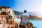 Male tourist enjoying spectacular view from the highs to Navagio beach on Zakynthos island