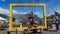 Male tourist with face mask framed with Table Mountain in background. The man is a paraplegic and is holding his wheelchair in the