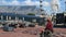 Male Tourist with face mask Table Mountain and big ferris wheel, man in wheelchair