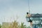 A male tourist flying on a zipline aka flying fox across the lake