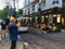 Male tourist shoots video outside La Bonne Franquette, noted cabaret on Montmartre in Paris, France