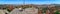 Male tourist squatted on the observation deck of Ankara Castle Turkey - widescreen panorama of the city. Colorful cityscape of